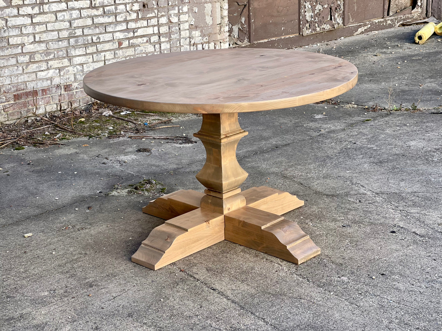 Hand carved round pedestal table