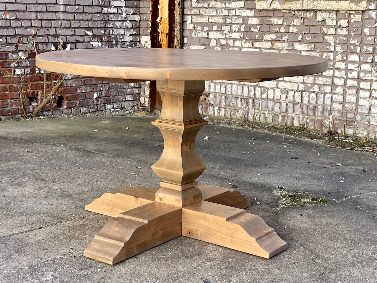 Hand carved round pedestal table