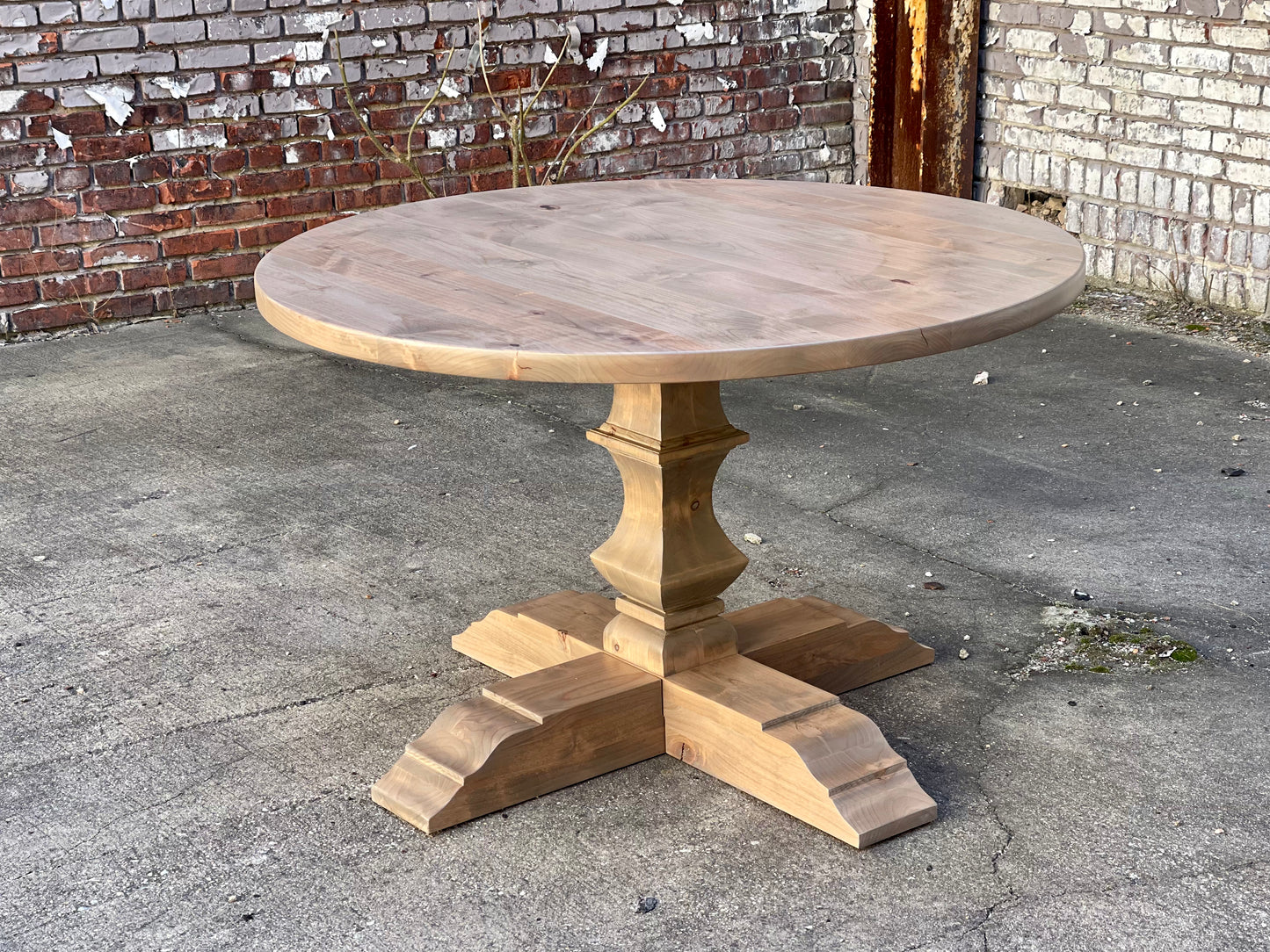 Hand carved round pedestal table