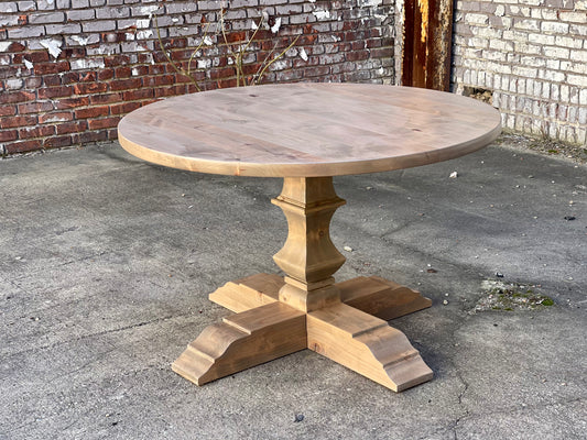 Hand carved round pedestal table